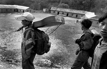 Maoist children with a guitar and drum in a village in Rolpa District, one of the Maoist strongholds during the 1996 - 2006 civil war.