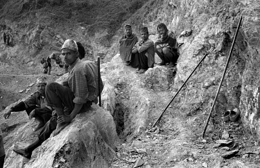 Forced labourers work to construct a road for the Maoists in Rolpa District, one of the Maoist strongholds during the 1996 - 2006 civil war.