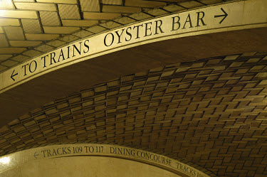 Signage for trains and oyster bar at Grand Central Station.