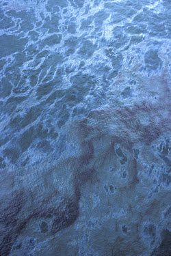 Oil slicks in coastal water when the Amoco Cadiz, a VLCC (Very Large Crude Carrier), split in two after running aground on Portsail Rocks, off the coast of Brittany, France, on March 16, 1978. The fir...