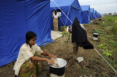 A tent camp for those displaced by Cyclone Nargis, which hit Burma on 02/05/2008. Camps like this one, which is less than an hour's drive from Yangon, have been nicknamed 'show camps' as visiting dign...