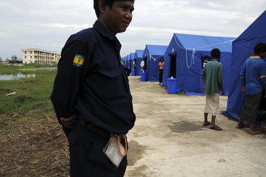 An official from the Ministry of Electric Power (MOEP) at a tent camp for those displaced by Cyclone Nargis, which hit Burma on 02/05/2008. Camps like this one, which is less than an hour's drive from...