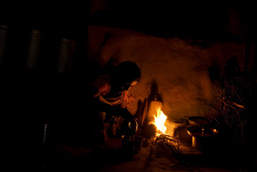 Kusum preparing dinner for her and her family after returning from her field. She gets up at 5am to begin her household chores, after which she works as a day laboure from 8am to 2pm. After that she r...