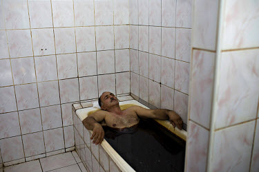A man receives a petrol bath at the Naftalan Health Centre. The use of oil has proved especially beneficial for rheumatic and circulatory problems.