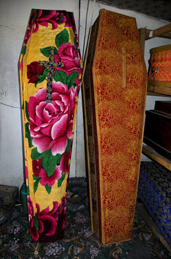 At a coffin makers in Addis Ababa, coffins selling for 50 USD are covered with colourful fabric.