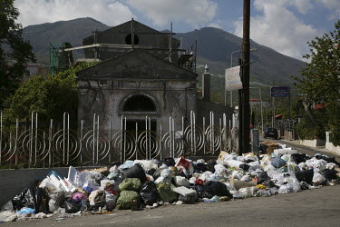 Below Mount Vesuvius on the outskirts of the city, domestic rubbish accumulates as the dispute between the local government and the Camorra, the Naples mafia who control waste management in the area,...