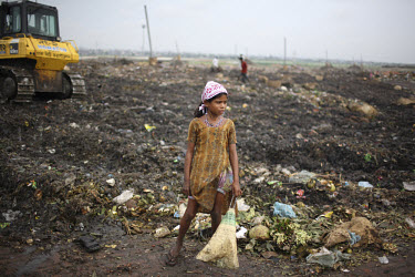 Children collecting rubbish for resale. At the end of each day, they earn TK 55 to 70 (USD 1). The Matuail Dump is one of three waste sites in Dhaka, a city of over ten million people. On average, 5,0...