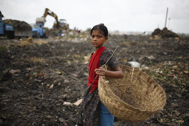 A girl collecting rubbish for resale. At the end of each day, she earns TK 55 to 70 (USD 1). The Matuail Dump is one of three waste sites in Dhaka, a city of over ten million people. On average, 5,000...