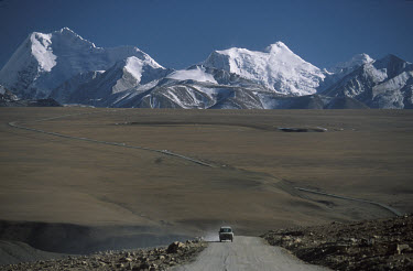A vehicle on "The Friendship Highway" passing through  the Himalayan mountains.