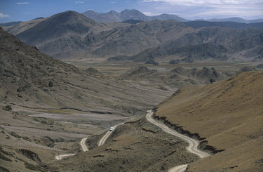 A Toyota Landcruiser descends from a 4,800 metre pass, east of Saga town on the Tibetan Plateau.