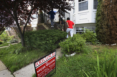 Would-be buyers get a tour around foreclosed houses in Woodbridge, Virginia. The area is suffering from a major collapse in the housing market following the subprime crisis and global credit crunch, w...