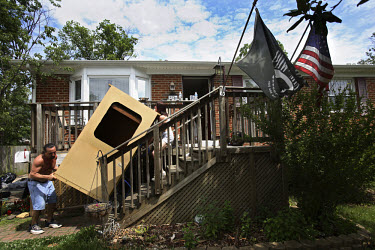 Patrizio Romano and Trabitha Johnson Smith help their friend and neighbour, Tai Whitten, clear out all her belongings from her home in Manassas, Virginia. About two months ago Tai made the decision to...