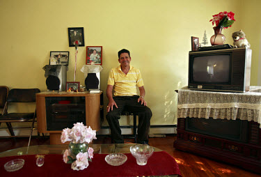Oscar Osorio, a Guatemalan immigrant, sits in his home in Woodbridge, Virginia. He can no longer afford his mortgage repayments, and will soon be moving out. The area is suffering from a major collaps...