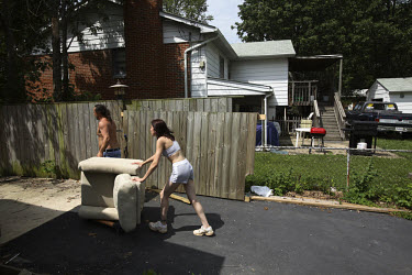 Patrizio Romano and Trabitha Johnson Smith help their friend and neighbour, Tai Whitten, clear out all her belongings from her home in Manassas, Virginia. About two months ago Tai made the decision to...