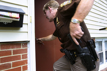 Deputy Rick Booth from the Manassas Sheriff Office in Virginia breaks into a foreclosed house after he found the locks had been changed. The area is suffering from a major collapse in the housing mark...