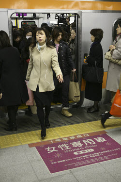 Women disembark from a 'women only' carriage at Shinjuku Station. JR (Japan Railways) has 16 tracks at Shinjuku Station and there are 38 tracks if you include the subway and metro lines along with the...