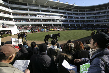 Horses parade prior to race 9 at the Nakayama Racecourse located in the suburbs of Tokyo in Funabashi. It is used only for horse racing and has a capacity of 165,676. It was built in 1990 and has 15,9...