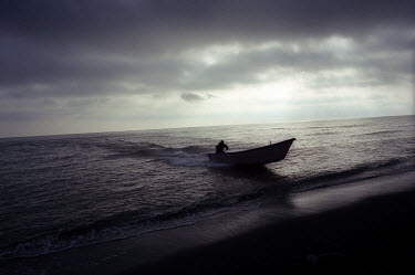 A fisherman beaches his boat after another unsuccessful morning fishing for sturgeon in the Caspian Sea. It is now not uncommon for the fishermen around Bandar-e Anzali to go for weeks without catchin...