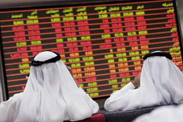 Stock market traders at Qatar securities market.