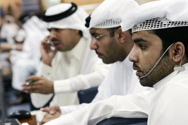 Stock market traders at Qatar securities market.