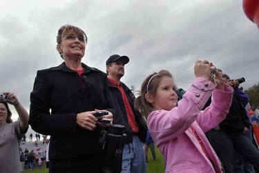 Sarah Palin, Governor of Alaska, with her daughter Piper at a cross country race in which her daughter Willow was taking part. In 2008 she was nominated as the Republican candidate for Vice President.