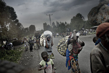 The road towards Goma crowded with IDPs (Internally Displaced Persons) fleeing violence in the towns and villages of Sake, Kirotske, Ngumba, Kilugu, Karuba and Mushaki. Tens of thousands are on the ro...