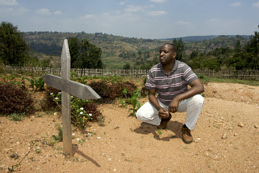 Sylvere Mudendeli at the massacre site of Kabuye, where most of his family were killed during the 1994 genocide. "You don't reflect too much for fear of it splitting your head."