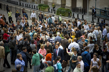 A crowd gathers on Wall Street on the day when share prices plummeted after the US Government failed to reach an agreement to bail out the country's ailing financial institutions.