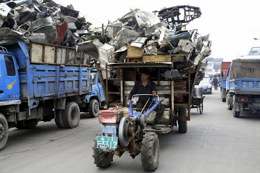 Workers break down and sort scrap materials at a recycling yard near Wenzhou. While some of the scrap material is collected from around the country, most are imported in bulk from developed countries...