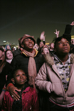 A family listen to the speech given by Barack Obama after his victory in the 2008 presidential election. Supporters of Obama gathered in Grant Park, Chicago for an emotional celebration as Obama becam...