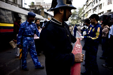 The fire brigade drag hoses in South Mumbai as ructions continue following the multiple terrorist attacks launched in Mumbai on 26/11/2008.