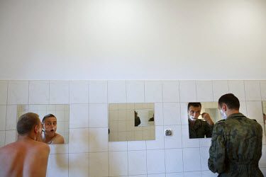 Young soldiers shave in their barracks. This year's class of drafted recruits is the final one after 90 years of compulsory military service, as Poland's army turns professional in 2009.