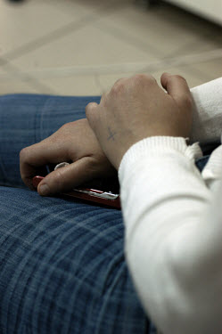 A young Iraqi Christian refugee girl with a cross tattooed on her hand attends a course about domestic violence, children's education and an English class given by the United Nations High Commissioner...