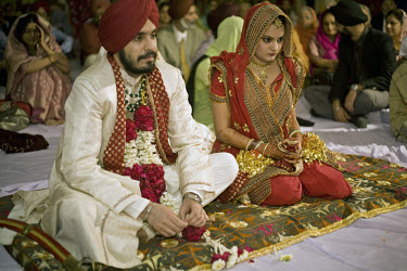 The bride and groom at a wealthy Sikh wedding.
