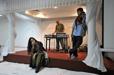 "Shadia" (Shadia Mansour), left, a British hip hop artist, rehearses before performing in front of an audience in Nablus, during a hip hop concert made up of European-Palestinian artists. She is the d...