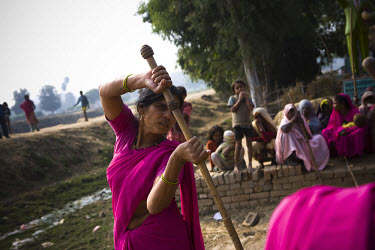 47 year old Sampat Pal Devi, founder and leader of the 10,000 strong 'Gulabi Gang' (Pink Gang), trains other women in the group to fight with lathis (traditional Indian sticks). In the badlands of Bun...