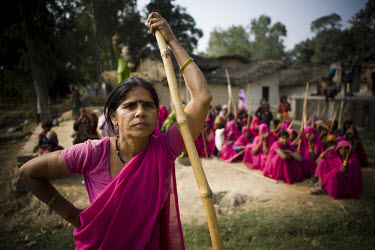 47 year old Sampat Pal Devi, founder and leader of the 10,000 strong 'Gulabi Gang' (Pink Gang), trains other women in the group to fight with lathis (traditional Indian sticks). In the badlands of Bun...