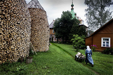 A nun gathers firewood for the Puhtitsa convent. 160 nuns and novices live in the convent.