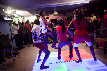 Contestants dance to hip hop music at an open mic and dance contest held at a nightclub in the middle class Ikeja neighbourhood.