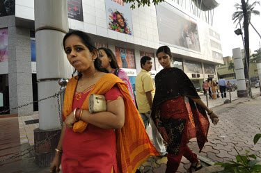 MIddle class women in front of the exclusive shopping mall, 'Atria Mumbai, The Millennium Mall'.