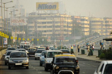 A large Nikon advert looks down upon traffic on Marine Drive.