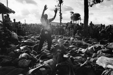 A man cries out surrounded by dead bodies in the Kibeho camp. Over 4,000 Hutus were killed on 22/04/1995 during an operation by the Tutsi Rwandan army to clear the Kibeho refugee camp. The tragedy occ...
