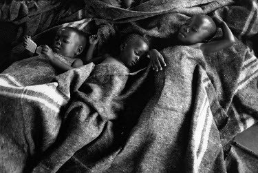 Three of over 1000 orphans at the Centre for Unaccompanied Children in Butare. Over 4,000 Hutus were killed on 22/04/1995 during an operation by the Tutsi Rwandan army to clear the Kibeho refugee camp...