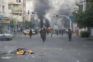 Basij (Basiji) militia and Revolutionary Guards on Khosh Street. Following a disputed election result, thousands of supporters of opposition candidate Mir-Hossein Mousavi took to the streets in protes...