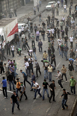 Demonstrators on Khosh Street throw missiles. Following a disputed election result, thousands of supporters of opposition candidate Mir-Hossein Mousavi took to the streets in protest.