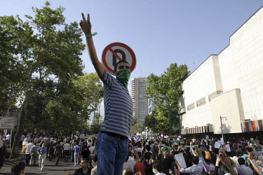 Silent protest. An estimated one million people form a human chain along Vali asr Avenue, the longest street in Tehran. Following a disputed election result, thousands of supporters of opposition cand...