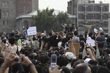 Mir-Hossein Mousavi waves to his supporters in Toopkhaneh Square. Following a disputed election result, thousands of supporters of opposition candidate Mousavi took to the streets in protest.