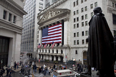The New York Stock Exchange (NYSE) on Wall Street, with a statue of George Washington at right.