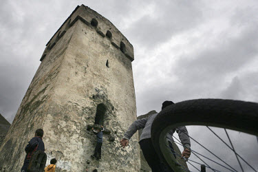 Children play around an old watchtower in El-Tyubyu, in the republic of Kabardino-Balkaria in the North Caucasus.