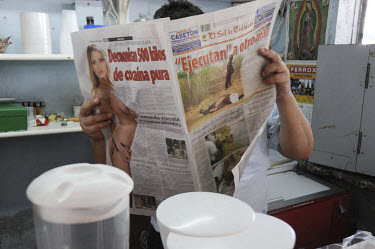 A man reads about drug busts and executions in the local Culiacan newspaper. Culiacan is the state capital of Sinaloa, base of the feared Sinaloa drugs cartel that is involved in a bloody power strugg...